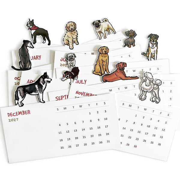 A variety of illustrated dogs on the top of each die cut month on a desktop calendar shown as individual monthly cards.