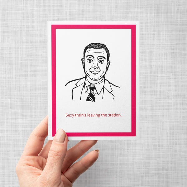 A hand holding a greeting card featuring a black and white line art portrait of Brooklyn Nine Nine's Boyle, framed by a bold red border. Below the illustration, the red text reads 'Sexy train's leaving the station.'