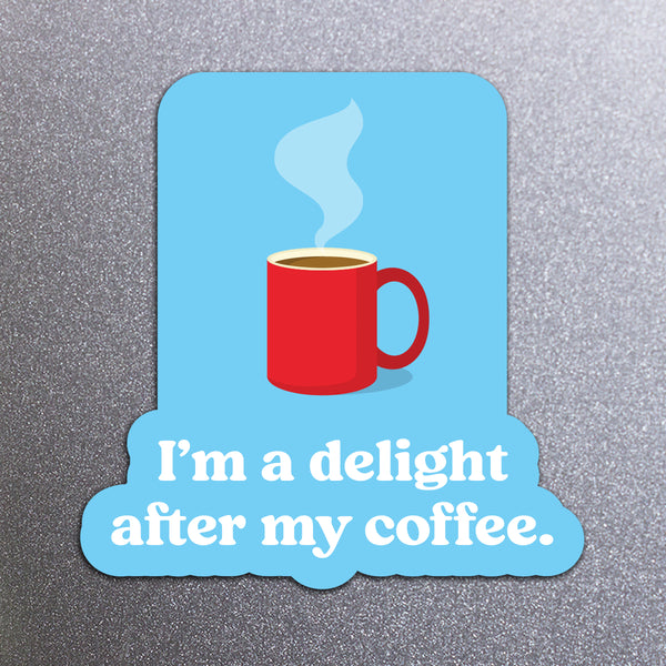 Red coffee mug with steam on a blue background magnet with text 'I'm a delight after my coffee' on a fridge background.
