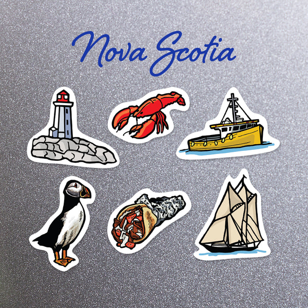 Set of Nova Scotia themed magnets including Peggy's Cove, a lobster, a fishing boat, puffin, donair and the Bluenose.