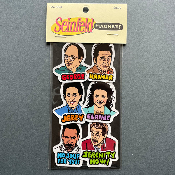 Packaged Seinfeld magnets with character faces and text on a gray background