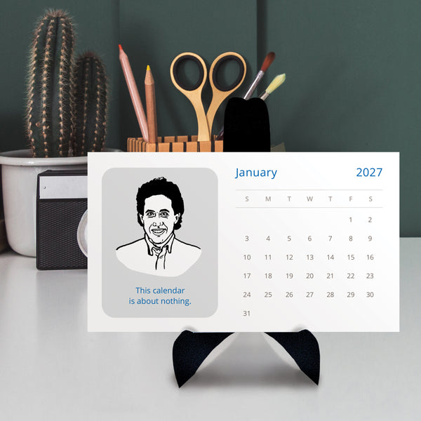 A 2027 desk calendar featuring a black-and-white illustrated portrait of Jerry Seinfeld on a black stand and text 'This calendar is about nothing.