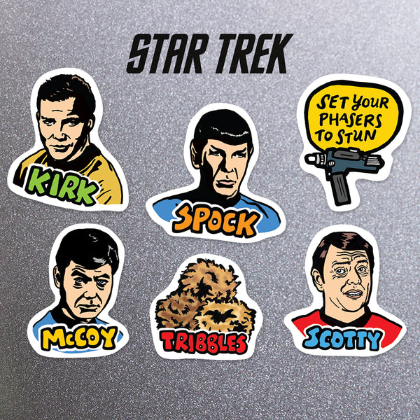 Set of Star Trek-themed magnets featuring characters and a phaser on a fridge background.