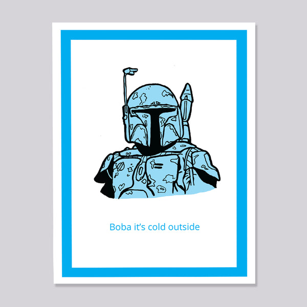 A greeting card featuring a stylized blue and black illustration of Boba Fett with the text 'Boba it's cold outside' below, set against a white background with a bright blue border, shown on a light gray backdrop.