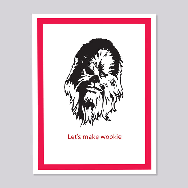 A greeting card featuring a black-and-white sketch of Chewbacca with the red text 'Let's make wookie' below, framed by a bold red border on a white background, shown against a light gray backdrop.