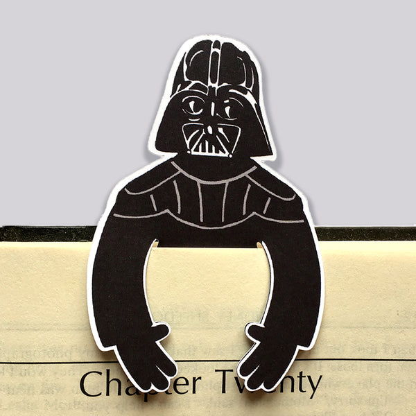 Darth vader character from star wars as a die cut bookmark. Arms clip over the front of a book page.