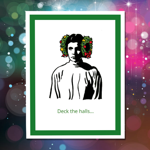 A greeting car featuring a stylized black-and-white portrait of Princess Leia with green holiday wreaths on the sides of her head, with the text 'Deck the halls' on a glittery background.