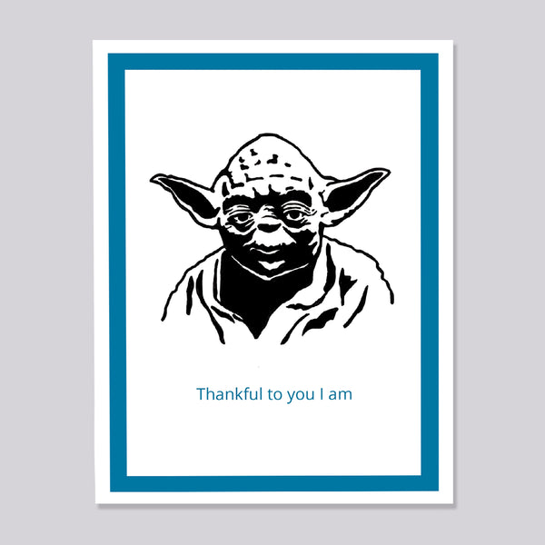 A greeting card featuring a black ink illustration of Yoda with the text 'Thankful to you I am' in blue below it, framed by a white border and a teal inner border on a light gray background.