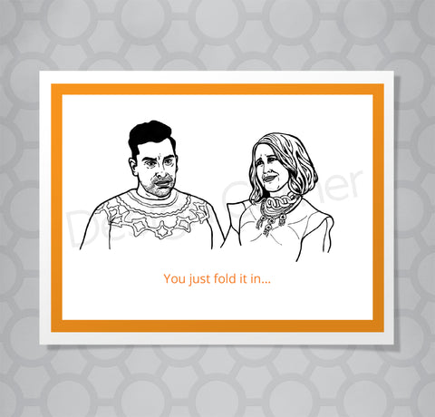 Greeting card with illustration of Schitts Creek David and Moira. Caption says, You just fold it in...