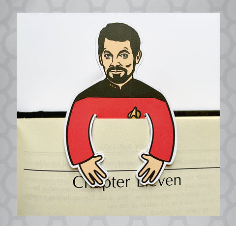 Illustration of Star Trek next generation's Will Riker as a die cut bookmark placed inside book. Caption on bookmark says "You're number one in my book."
