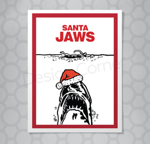 Illustration of Jaws movie shark with caption "Santa Jaws" on greeting card. Shark is wearing a santa hat.