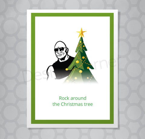 Illustration of Dwayne Johnson The Rock by a Christmas tree on a greeting card with caption "Rock around the Christmas tree"